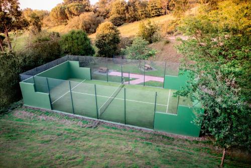 an overhead view of a tennis court in a park at Hotel Peñas Blancas in Liaño