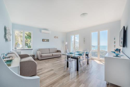 a living room with a table and a dining room at Casa Panorama, Terre Marine in Corniglia