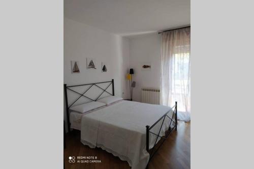 Giường trong phòng chung tại Casa Riccò di Cinzia e Samuele