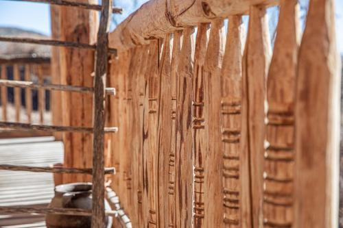 a wooden wall with wooden studs on a building at Hostal D'Éller in Éller