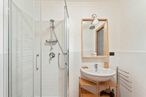 a bathroom with a sink and a shower at Gressoney Saint-Jean apartments by Halldis in Gressoney-Saint-Jean