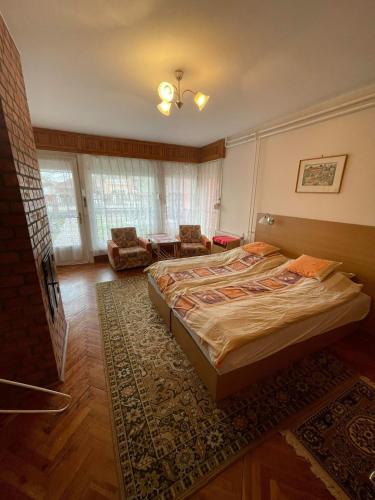 Postel nebo postele na pokoji v ubytování Körmendi Apartman