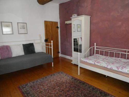 Ένα ή περισσότερα κρεβάτια σε δωμάτιο στο Am Backhaus
