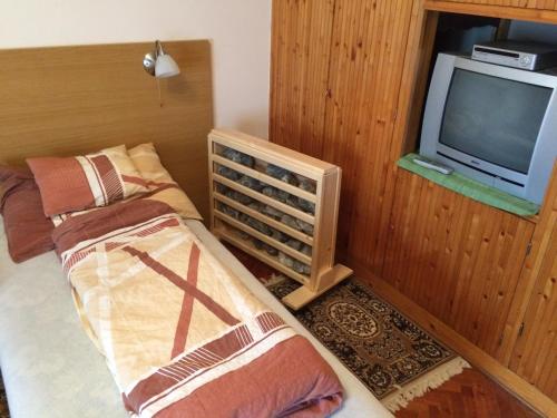 Postel nebo postele na pokoji v ubytování Körmendi Apartman