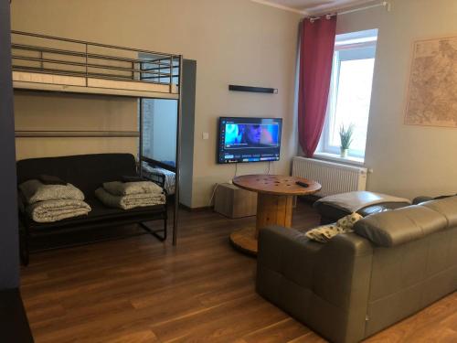 Televízia a/alebo spoločenská miestnosť v ubytovaní apartament Śródmieście 1 sypialnia oraz 1 salon
