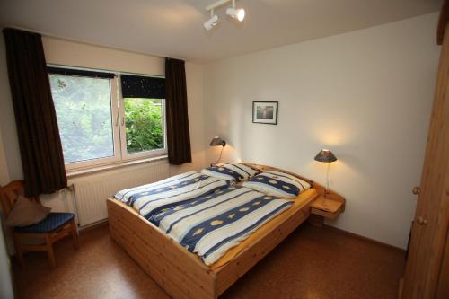 Postel nebo postele na pokoji v ubytování Bauernhof Sauer - Friesenglück