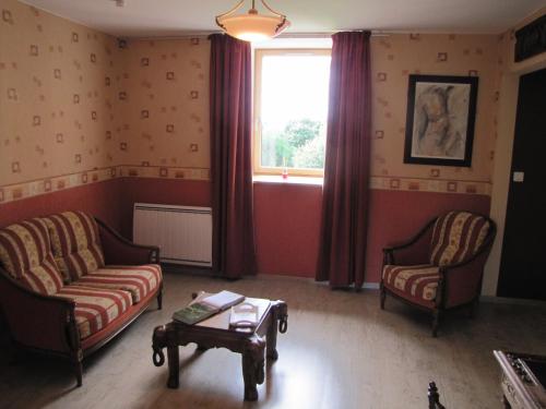 Χώρος καθιστικού στο Ludothèque chambres et table d'hôtes de La Becterie