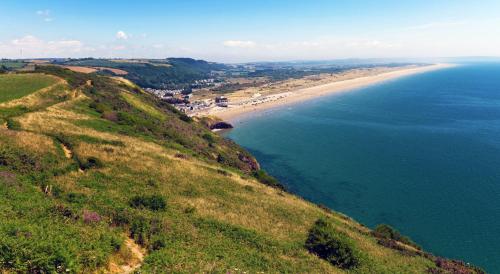 an aerial view of a beach and the ocean at Gwalia House- Stunning Central Townhouse with 3 ensuite bedrooms in Laugharne