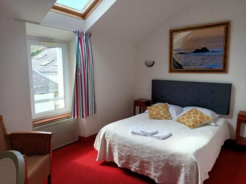 Ένα ή περισσότερα κρεβάτια σε δωμάτιο στο Hotel Saint Amant
