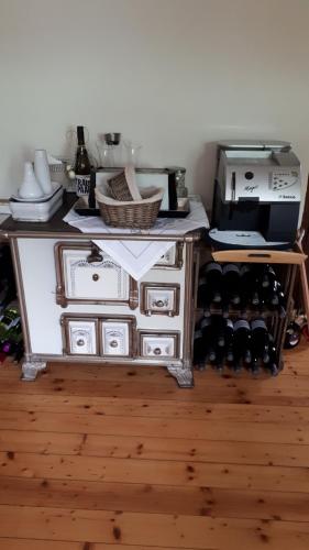 a cabinet filled with lots of bottles of wine at bel-etage in Liebshausen