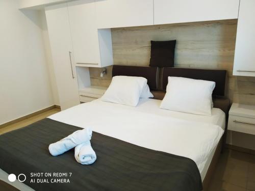 a bedroom with two beds with white sheets and pillows at Penzion Relax Martina in České Budějovice