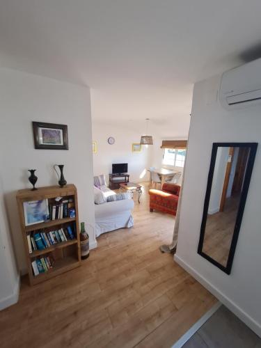 a living room with a couch and a mirror at River Ebro Apartments in Móra d'Ebre