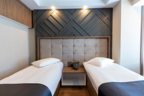 Cabir Deluxe Hotel Sapancaにあるベッド