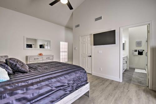 a bedroom with a bed and a flat screen tv at 8 mi to Westgate Family-Friendly Glendale Home! in Glendale