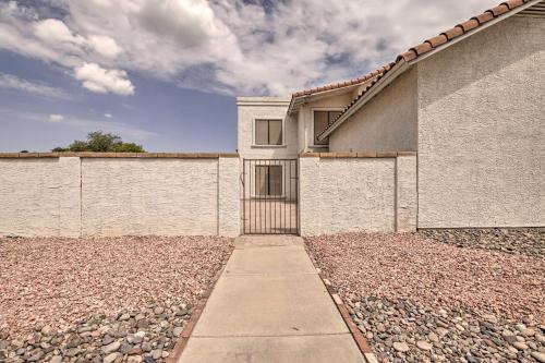 a building with a gate on the side of it at 8 mi to Westgate Family-Friendly Glendale Home! in Glendale