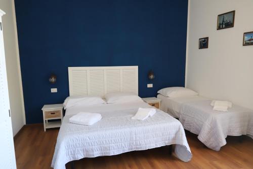 Postel nebo postele na pokoji v ubytování Ai Quattro Venti Guest House