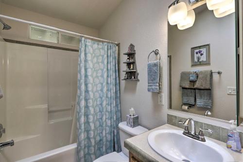 a bathroom with a sink and a toilet and a shower at Rustic Retreat Moab Townhome with Grill and Fire Pit in Moab