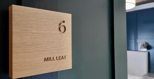 a wooden door with the number six on it at Furzeleigh Mill Inn in Buckfastleigh