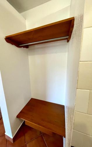 a room with a wooden shelf on the wall at HOTEL BUGAMBILIAS in Oaxaca City