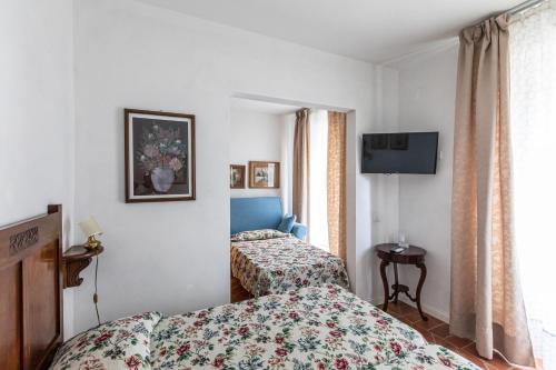 Ένα ή περισσότερα κρεβάτια σε δωμάτιο στο La Locanda di Adele - Il Giardinetto B&B