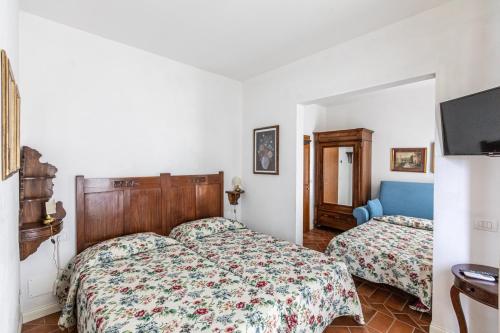 Ένα ή περισσότερα κρεβάτια σε δωμάτιο στο La Locanda di Adele - Il Giardinetto B&B
