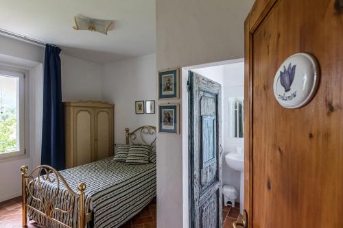 Ένα ή περισσότερα κρεβάτια σε δωμάτιο στο La Locanda di Adele - Il Giardinetto B&B