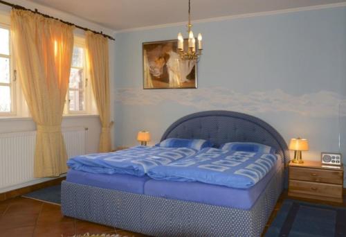 Katil atau katil-katil dalam bilik di Ferien unterm Reetdach Whg 02