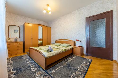 Кровать или кровати в номере Дом с прекрасным видом в г. Киеве
