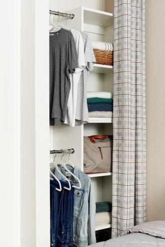a closet filled with lots of clothes at InTown Suites Extended Stay Charlotte NC -East Independence in Charlotte