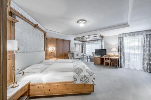 Кровать или кровати в номере Trofana Royal 5-Sterne Superior Resort