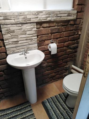 a bathroom with a sink and a toilet at 3 on Naude in Aliwal North