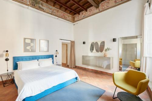 Кровать или кровати в номере Sonder Montevecchio