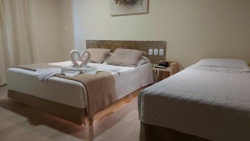 Postel nebo postele na pokoji v ubytování Porto Bali Hotel
