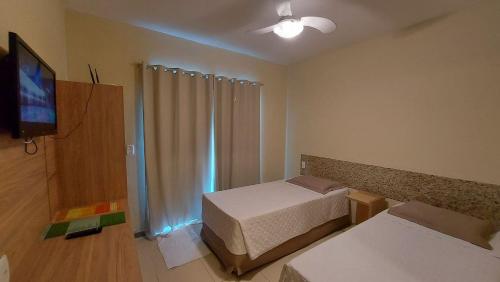 Postel nebo postele na pokoji v ubytování Porto Bali Hotel