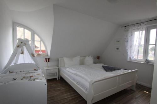 Postel nebo postele na pokoji v ubytování Reet-Hus Hanbutt