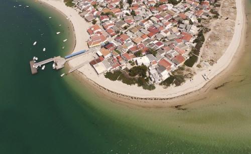 an aerial view of a small island in the water at Casa Paixanita - jacuzzi & terrace downtown Olhao in Olhão