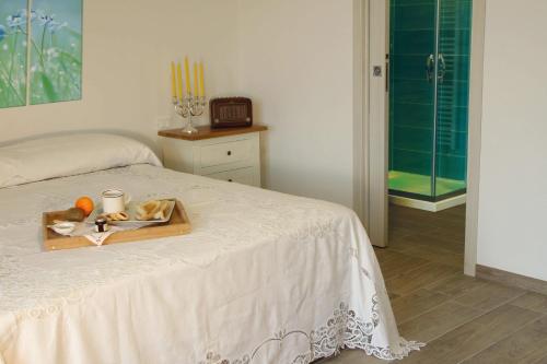 Ένα ή περισσότερα κρεβάτια σε δωμάτιο στο Agriturismo Albero del Miele
