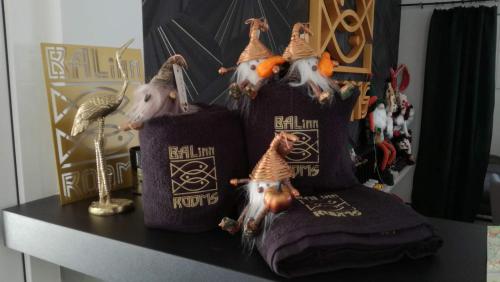 a table with three pillows with chickens on them at Balinn rooms in Balatonszepezd