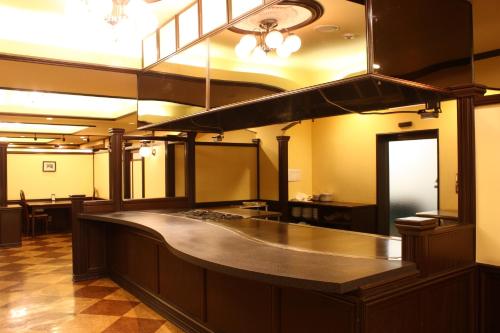 a large kitchen with a large counter in a room at Hotel Ichii in Kusatsu