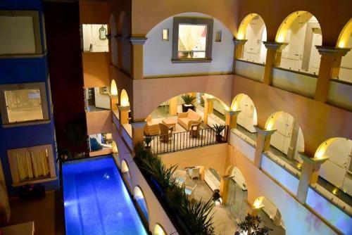 an overhead view of a building with a swimming pool at Posada de Maria Hotel Boutique & Spa in Durango