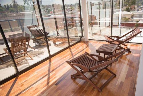 a group of chairs sitting on top of a balcony at Posada de Maria Hotel Boutique & Spa in Durango