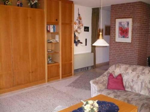 a living room with a couch and a table at Appartment 3737 in Tossens in Butjadingen OT Tossens