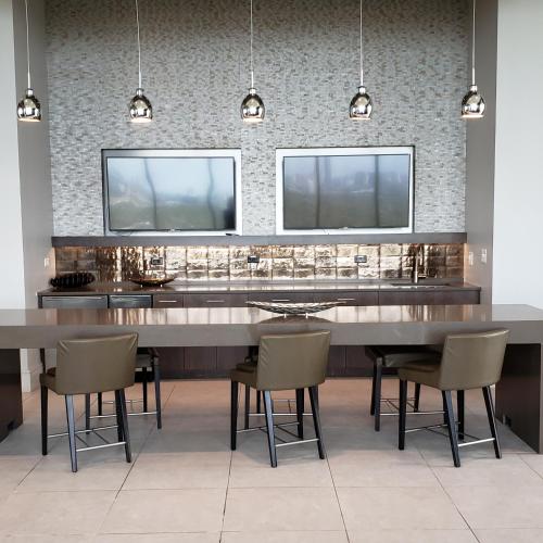 a dining room with a large table and chairs at Latitude Med Center in Houston