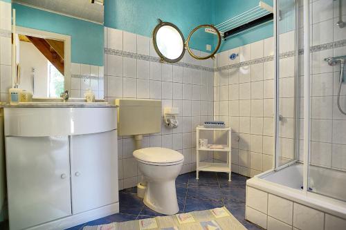 a bathroom with a toilet and a sink and a tub at Tabbert, Kerstin in Zingst