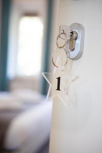 a key chain with the number one on it at CASA STELLA San Sisto in Perugia