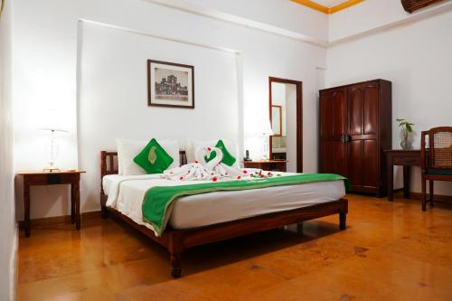 a bedroom with a large bed in a room at Saraca Hotel Lucknow in Lucknow