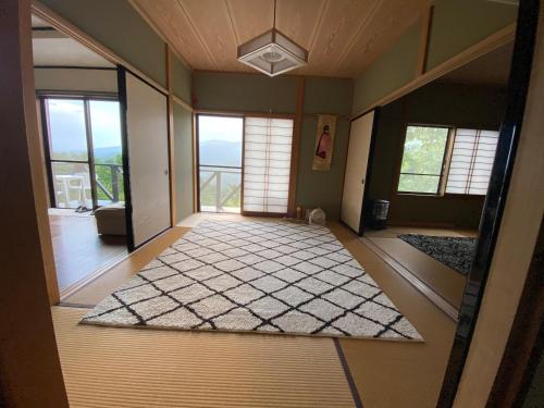 an empty room with a view of a living room at Mount Fuji Castle 2 in Yamanakako
