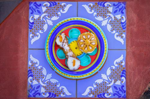 a plate of food on a colorful table at Venus Dream in Pantelleria