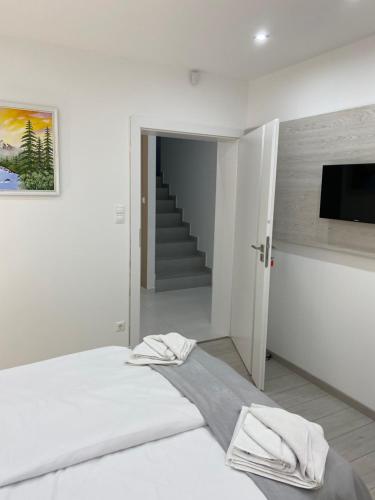 Katil atau katil-katil dalam bilik di Amira Apartman & Wellness