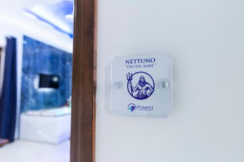 a sign on a door that says nothing to do for music at Pompei Luxury Rooms in Pompei